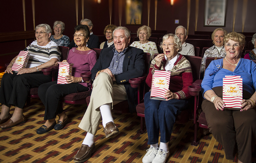 Residents enjoy the community movie theatre and popcorn