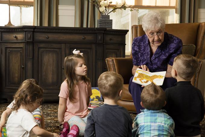 woman reading to kids